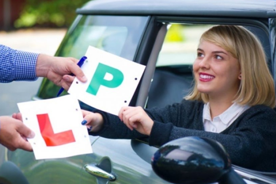 Woman taking a driving lesson